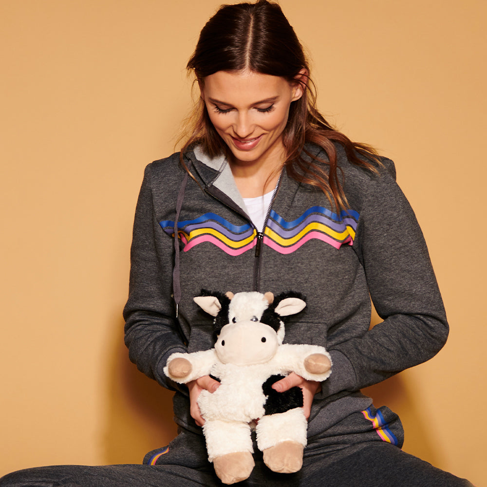 Image 105: Woman holding Plush Warm Weighted Black and White Cow Warmies