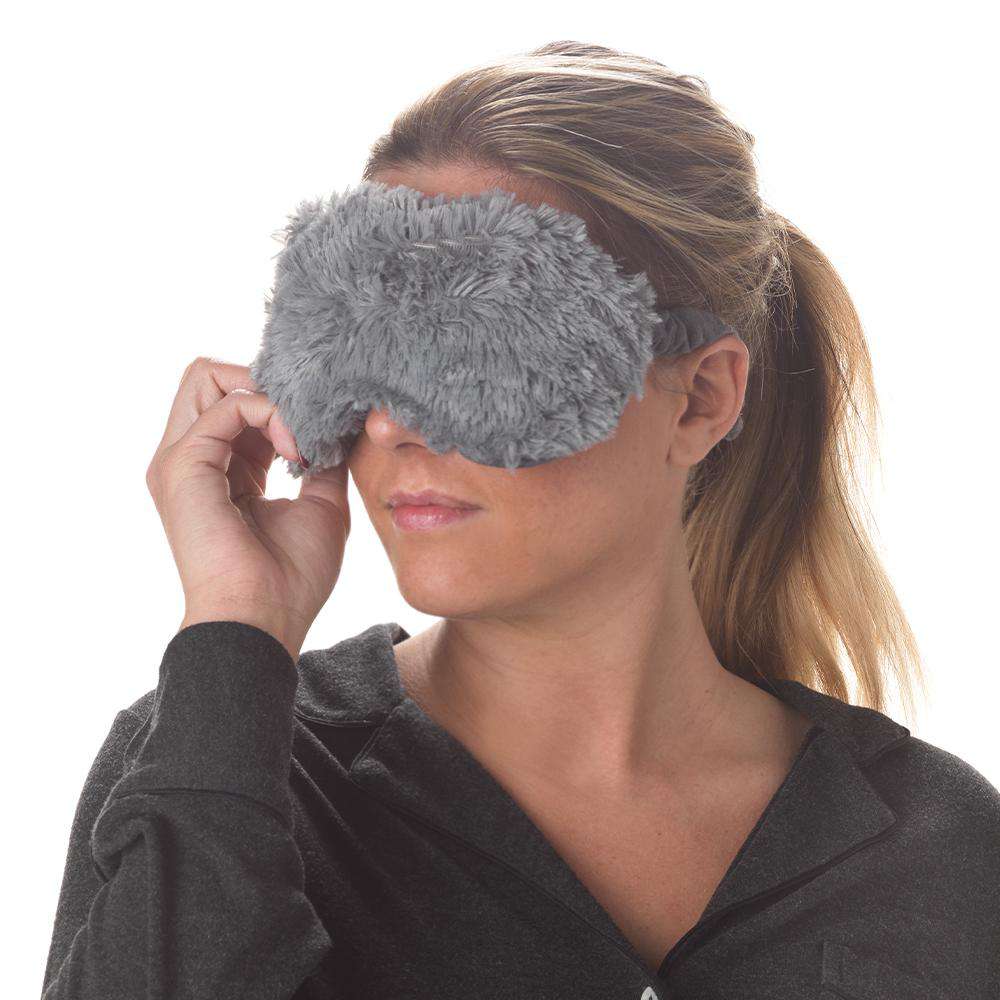 Image 90: Woman wearing Gray Warmies Eye Mask: Microwavable tranquility for soothing comfort.